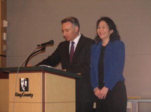 Holly Woo receives her service award from Executive Constantine