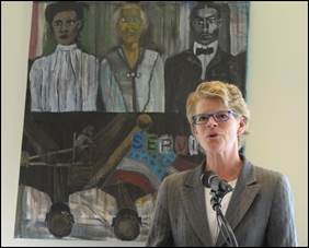 Adrienne Quinn, Director of the Department of Community and Human Services, speaking at the opening of August Wilson Place