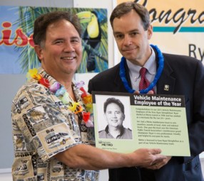 Ryan Stringfellow (left) receives Vehicle Maintenance's 2015 Employee of the Year from Rob Cannon (right)