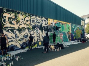 Young artists from around the Pacific Northwest spruce up the outside of the Archives and Records Center during the “Keeping it Fresh” graffiti contest