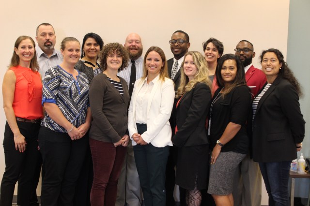 Pictured: This year’s Bridge Fellowship participants ar back row from left to right: Sean Douglas (KCIT), Linda Morales (DPH), Kerwin Pyle (DNRP), Mike Rheubottom (DOT), Ann Moses (KCIT) and Anttimo Bennett (KCSC). Front row from left to right: Kate Stein (DPH), Kelsey Hatch (KCAO), Rose Hickman (DCHS), Valerie Ceban (DES), Lynn Mckiernan Ngari (DES), Kamilah Brown (KCC) and Lilia Cabello Drain (DES).